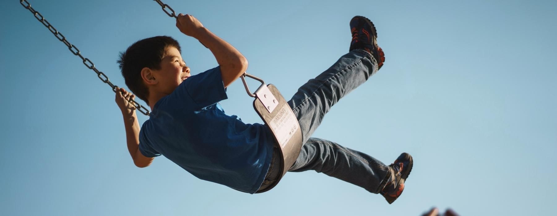 a boy on a swing