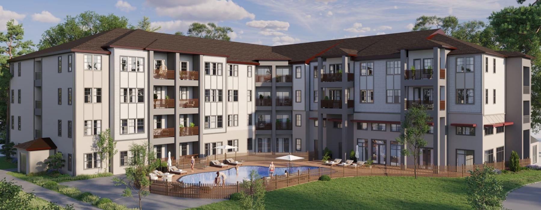 a building with a lawn in front and a pool